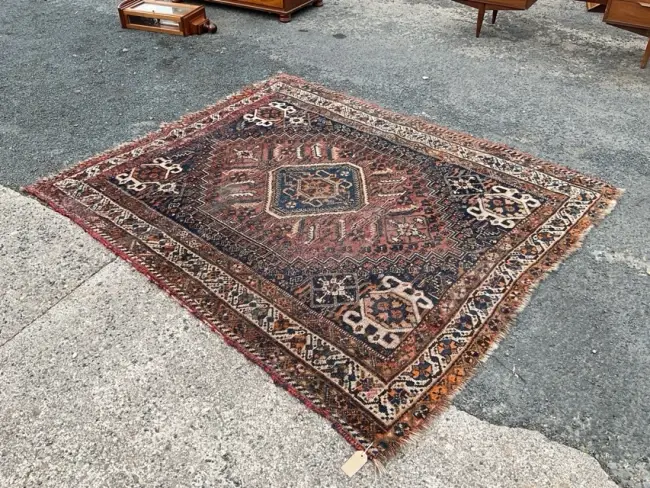 A Heriz wool rug woven with octagonal medallion and conforming spandrels
