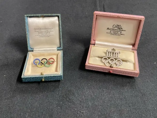 A 1936 Berlin Olympics enamelled gilt brooch by Paulmann & Crone of