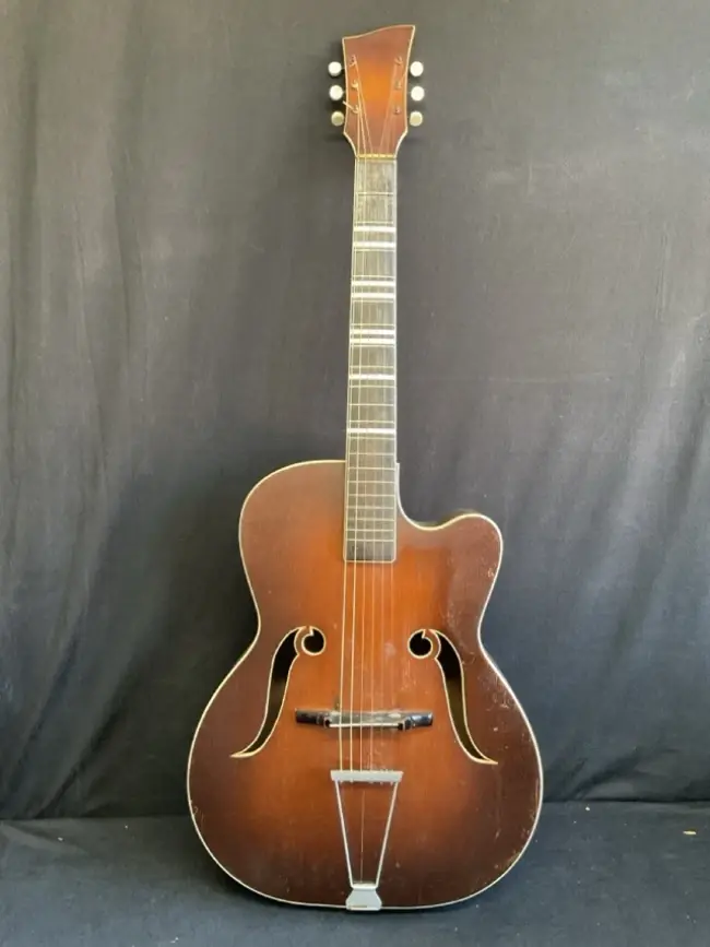 A 60s Melodija arched top acoustic guitar with ebonised neck, shaped