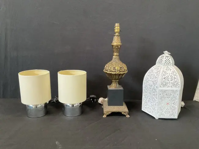 A pair of modern chrome tablelamps with cylindrical shades; a baroque
