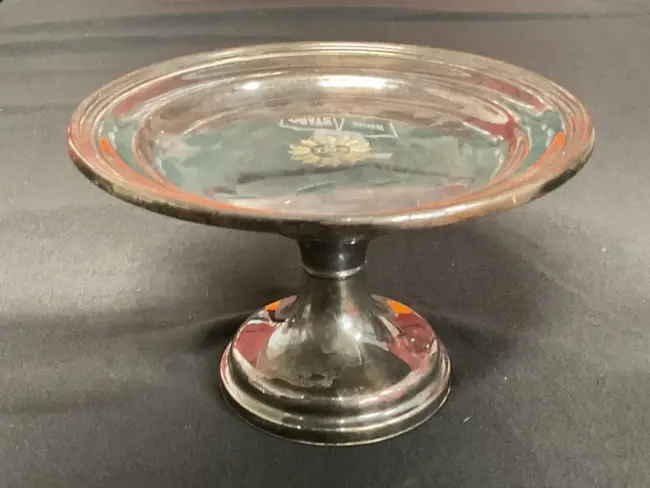 A silver plated ecclesiastical patten by James Dixon & Son, the circular