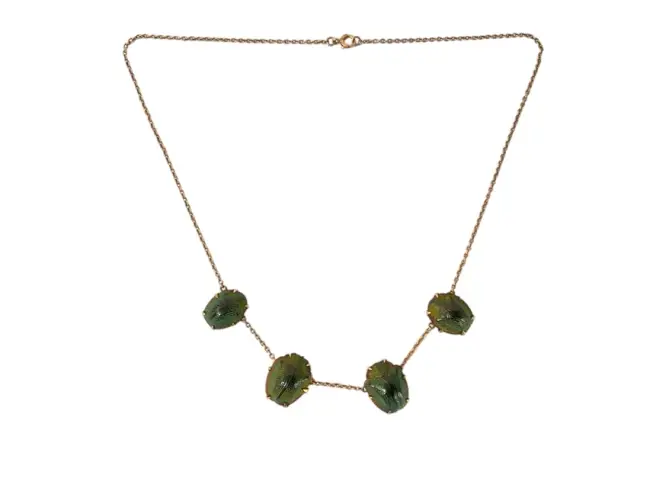 An antique unmarked gold scarab shell necklace, the four casings claw