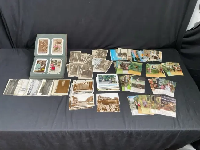 A 20s postcard album containing 74 miscellaneous cards; and a collection
