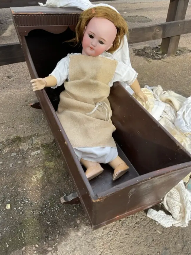 A German porcelain head doll by Simon & Halbig with sleep eyes and