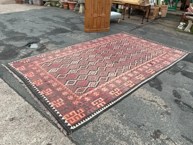 An Anatolian kilim wool rug woven with rows of interlocking zigzag