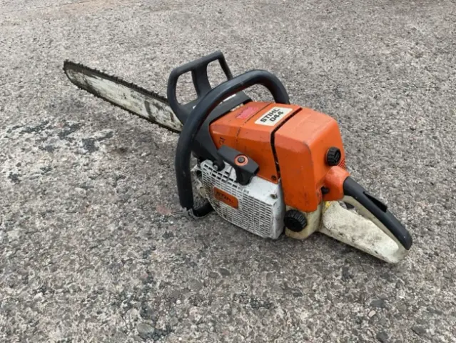 A Stihl petrol powered chain saw - model 044, with long 25in blade.