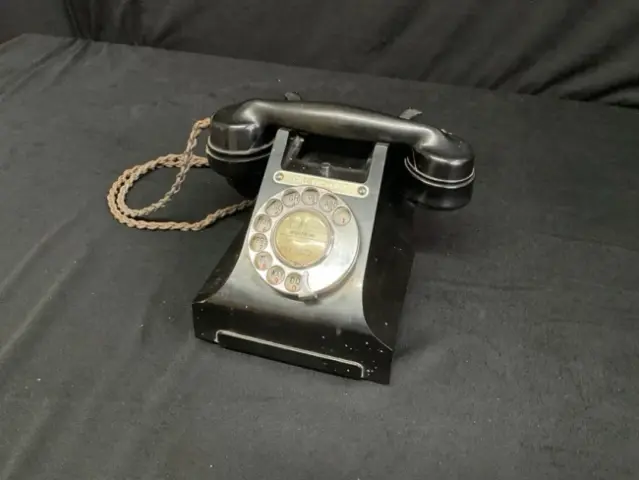 A 50s GPO 332L black bakelite rotary telephone, the receiver with