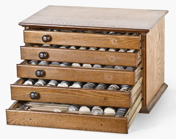 An early 20th century watchmaker's crystal cabinet with contents