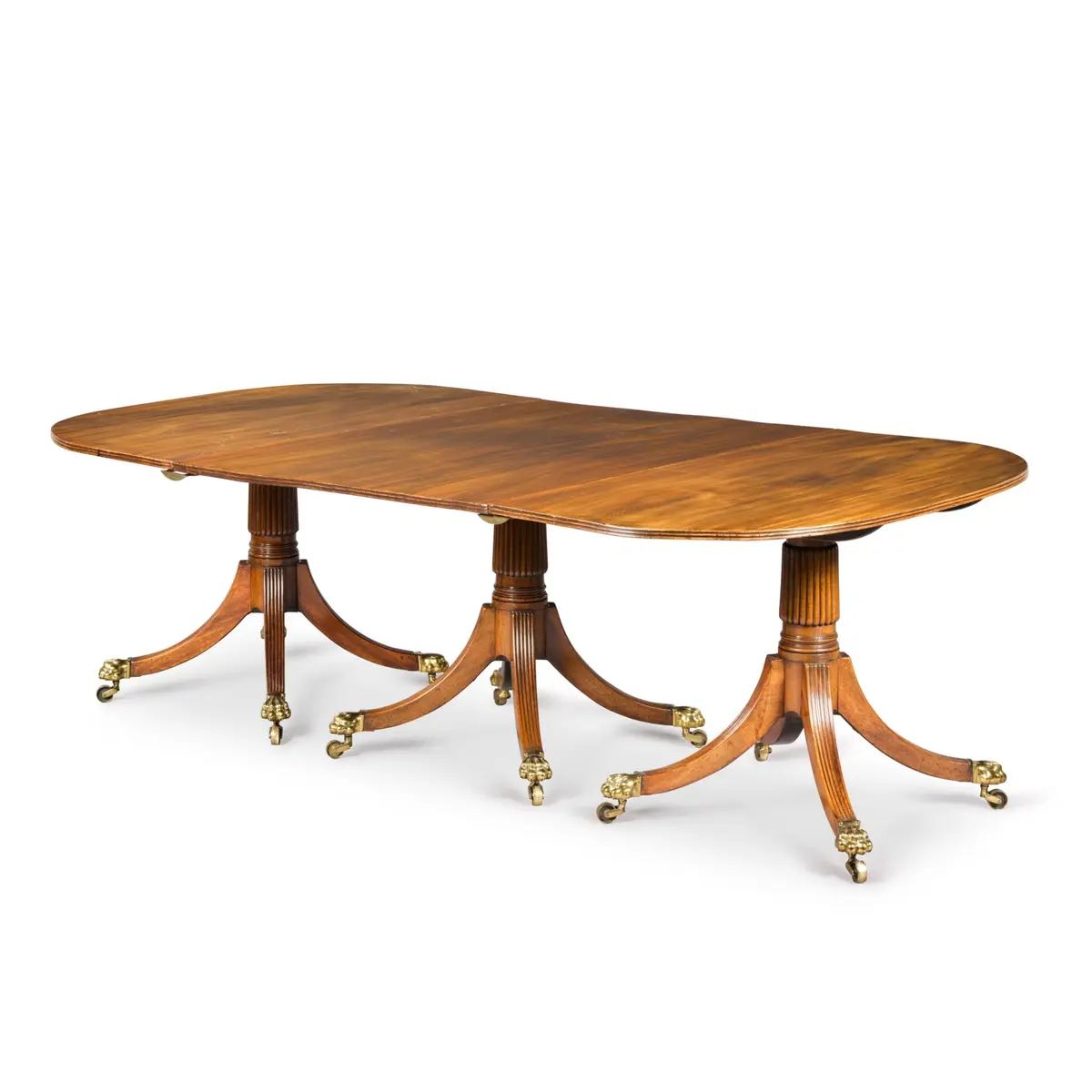 A Regency mahogany three-pedestal dining table, early 19th century