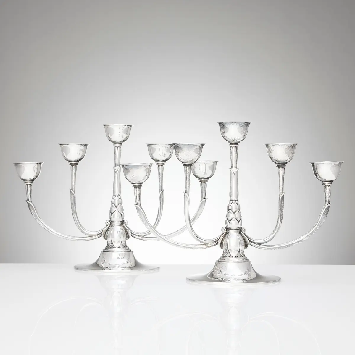 HARALD NIELSEN. Kandelabrar för fem ljus, ett par, sterlingsilver