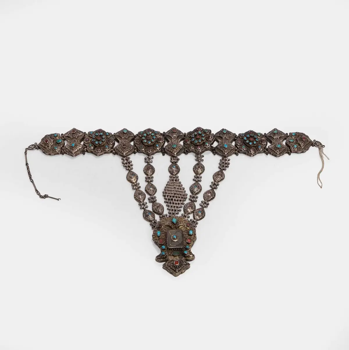 A gem-set and chased gilt white-metal pectoral ornament 19th century