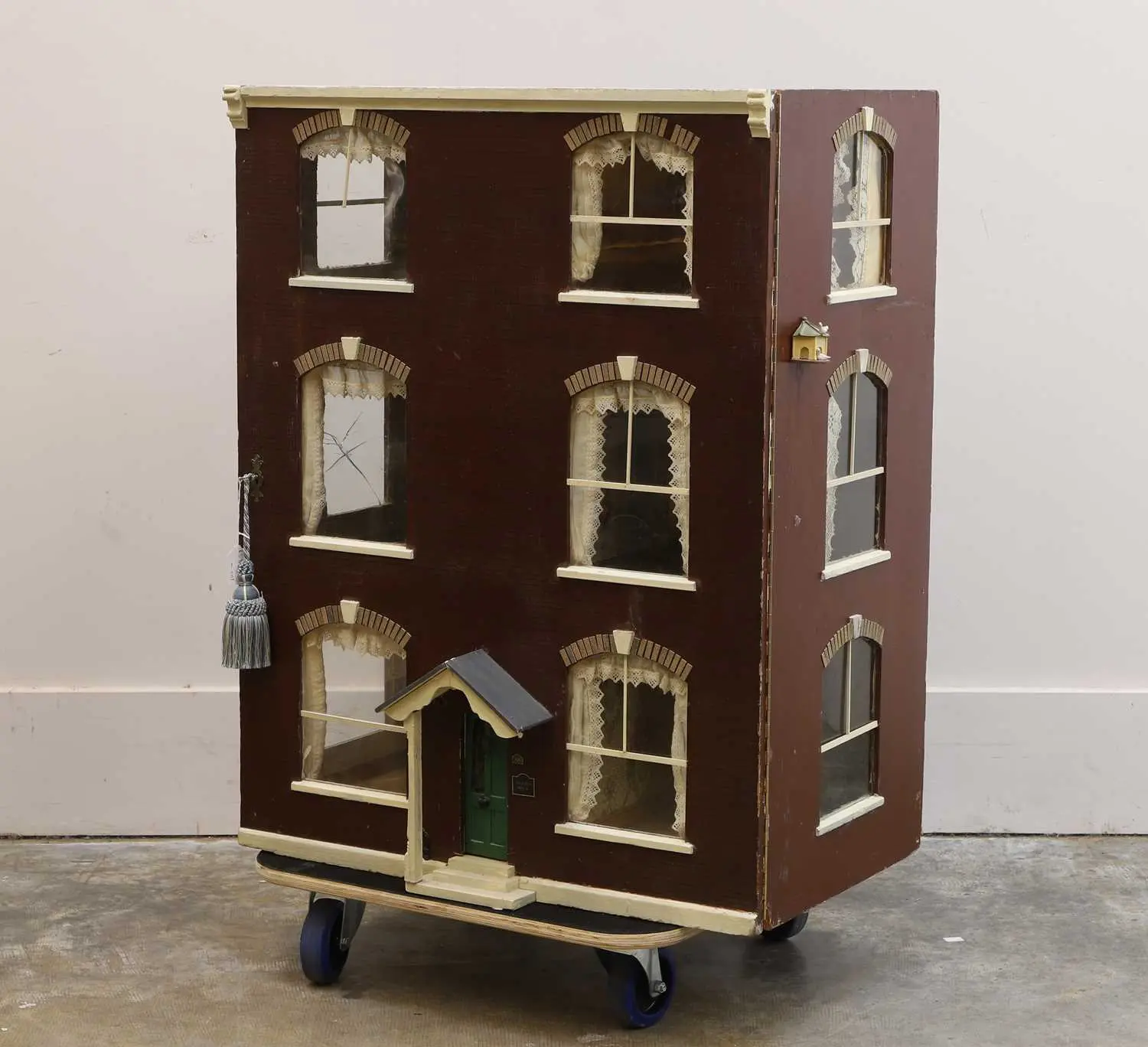 A Victorian three-story painted doll's house late 19th century