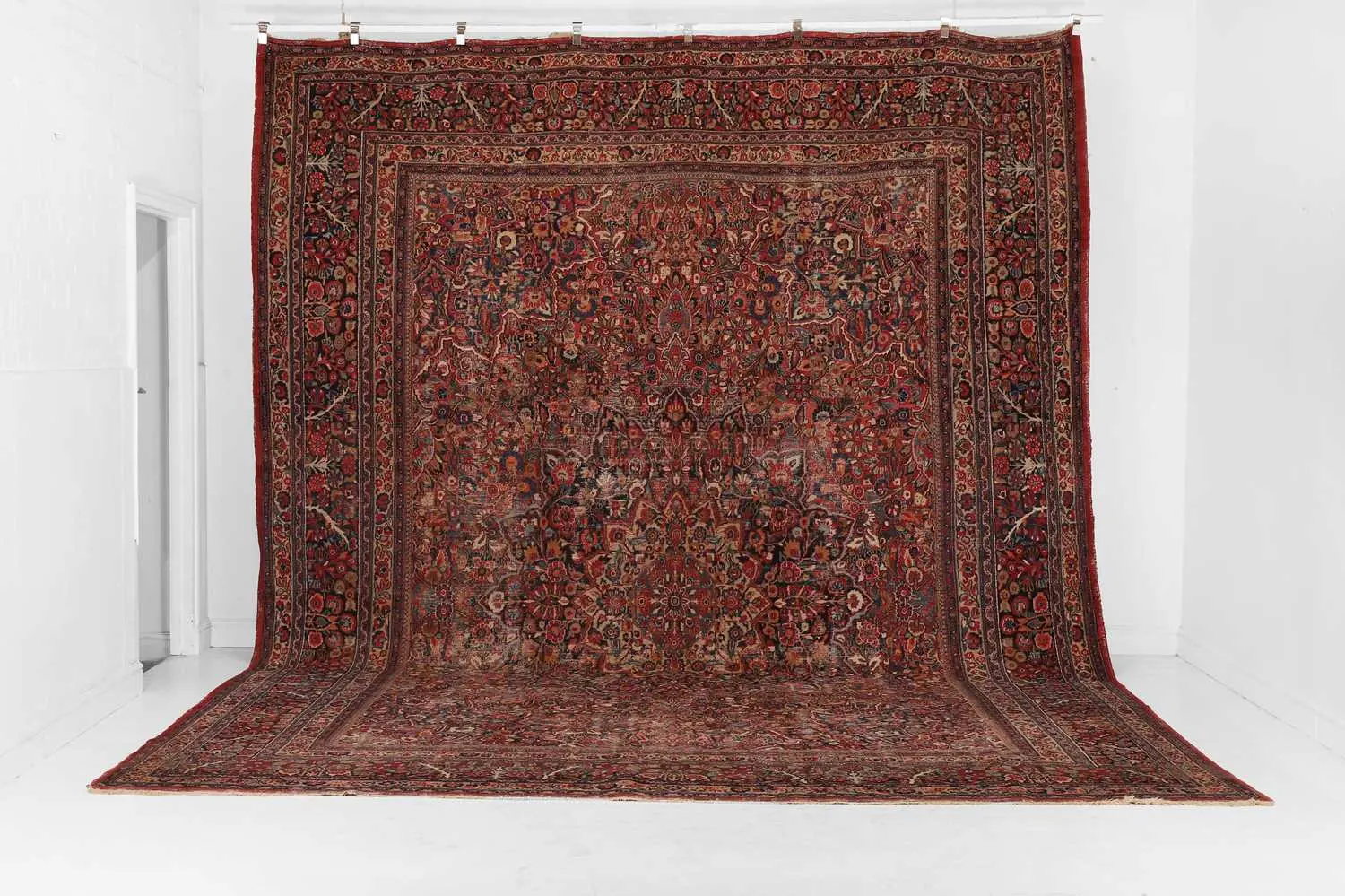 A large Mashad wool carpet 20th century, Persian