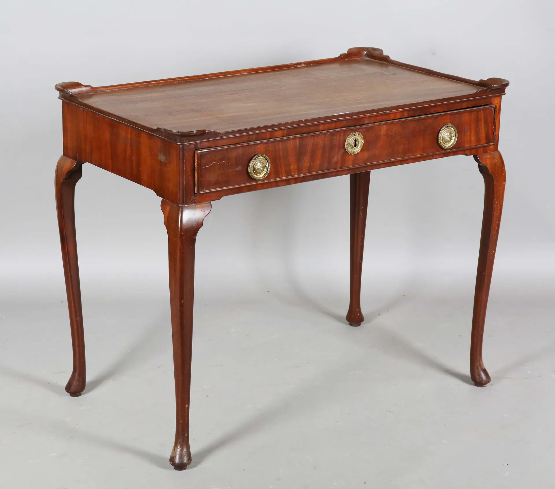 A 19th century mahogany silver table, the galleried top above a single