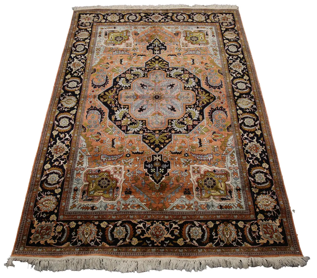 A Qum part silk rug, Central Persia, late 20th century, the dark salmon