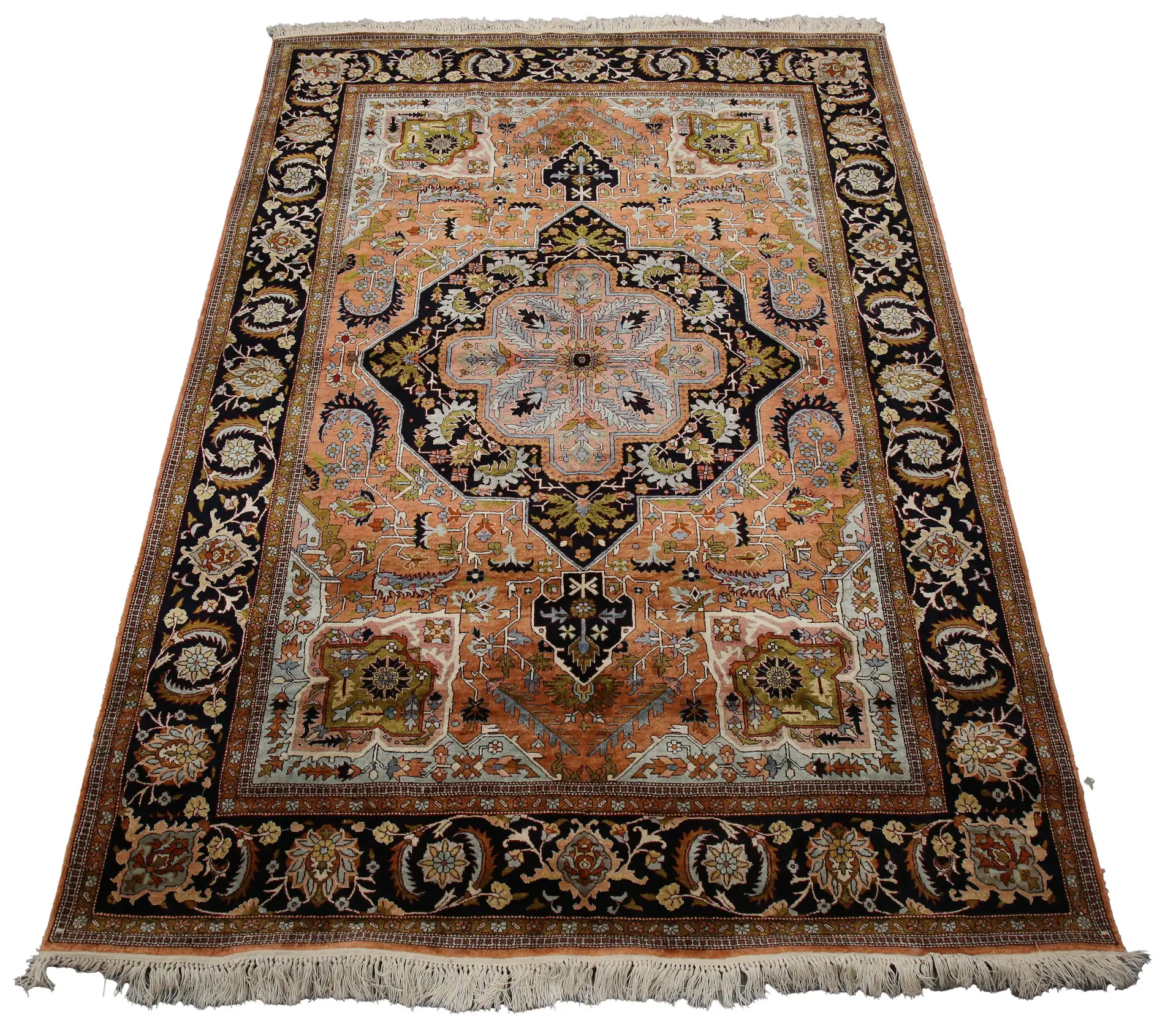 A Qum part silk rug, Central Persia, late 20th century, the dark salmon