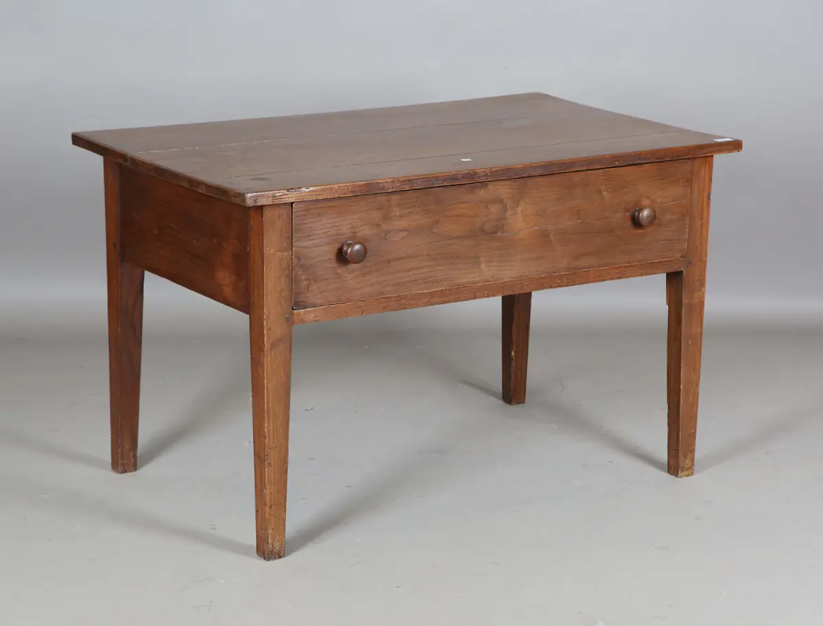 A 19th century French chestnut side table, fitted with a single frieze