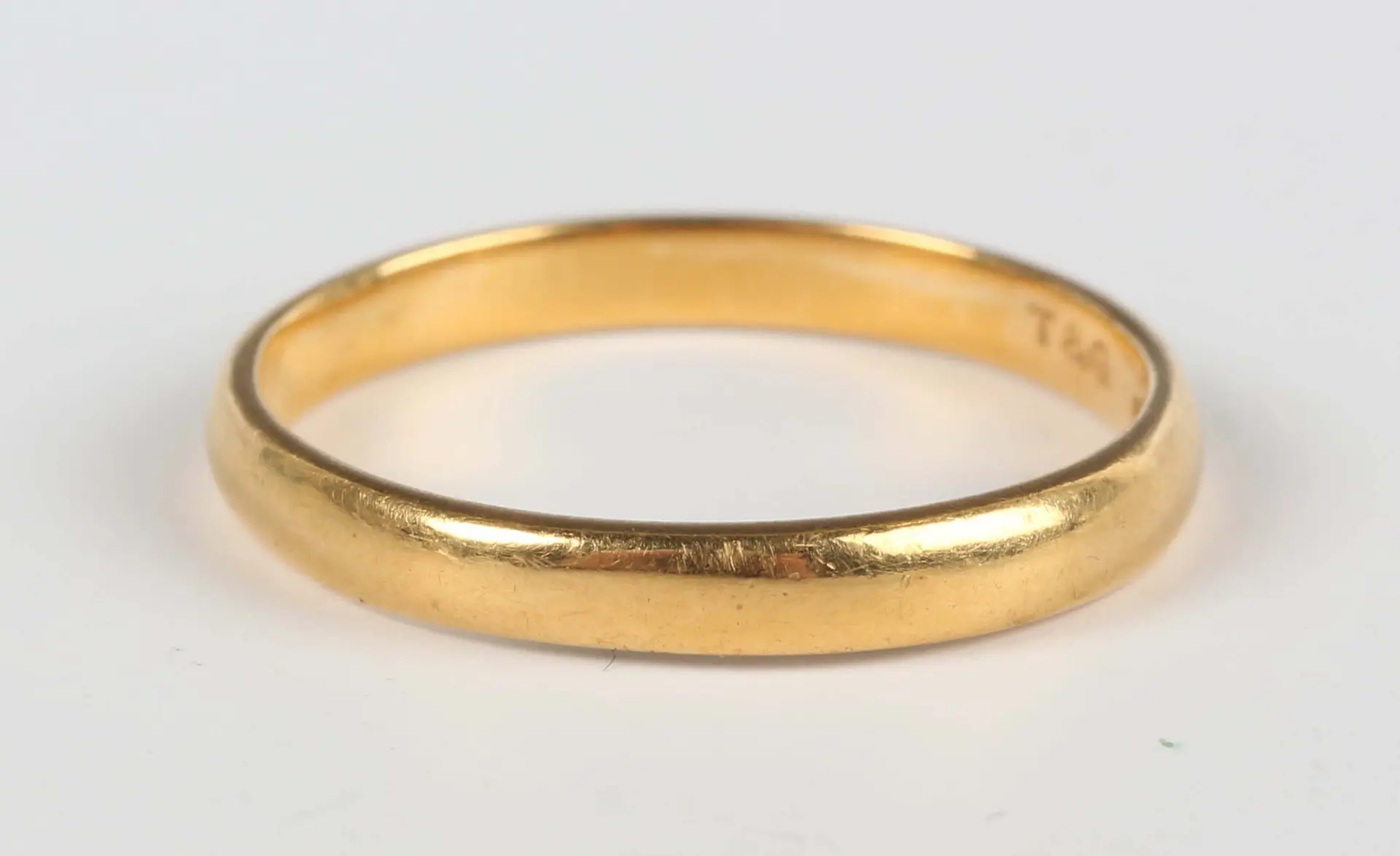 A 22ct gold wedding ring, London 1956, weight 1.9g, ring size approx J.
