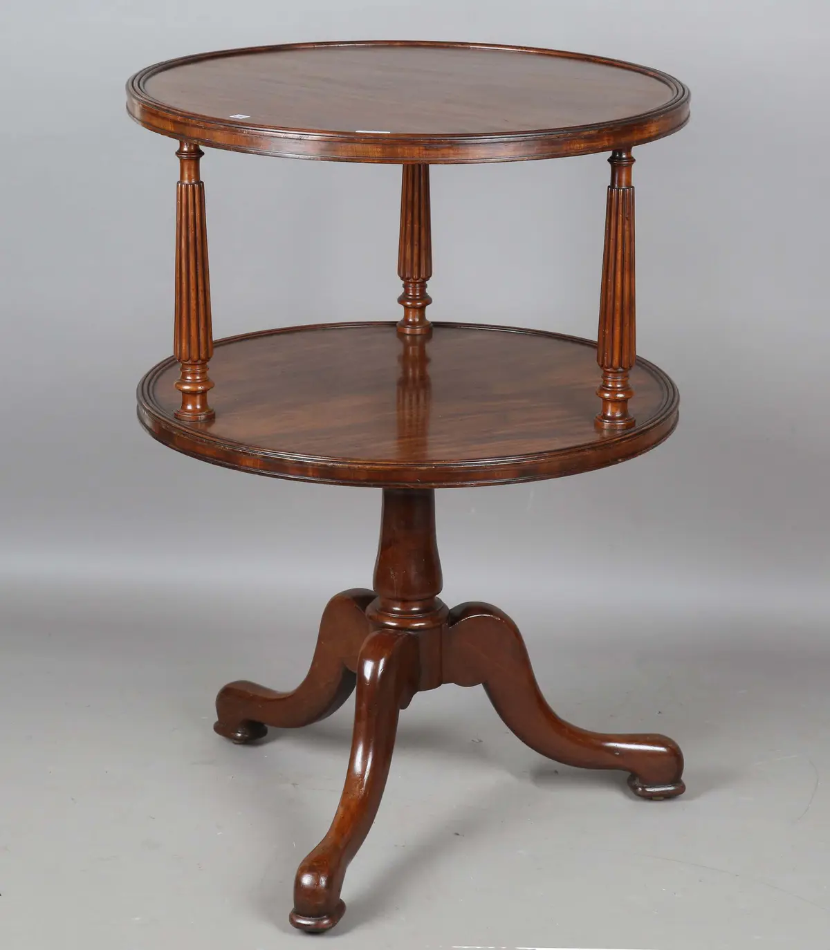 A mid-19th century French mahogany circular two-tier revolving dumb