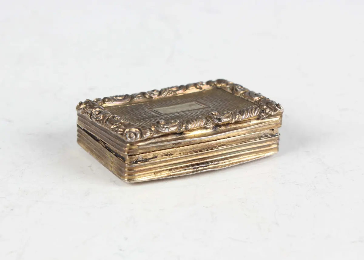 A George IV silver gilt rectangular vinaigrette with cast foliate