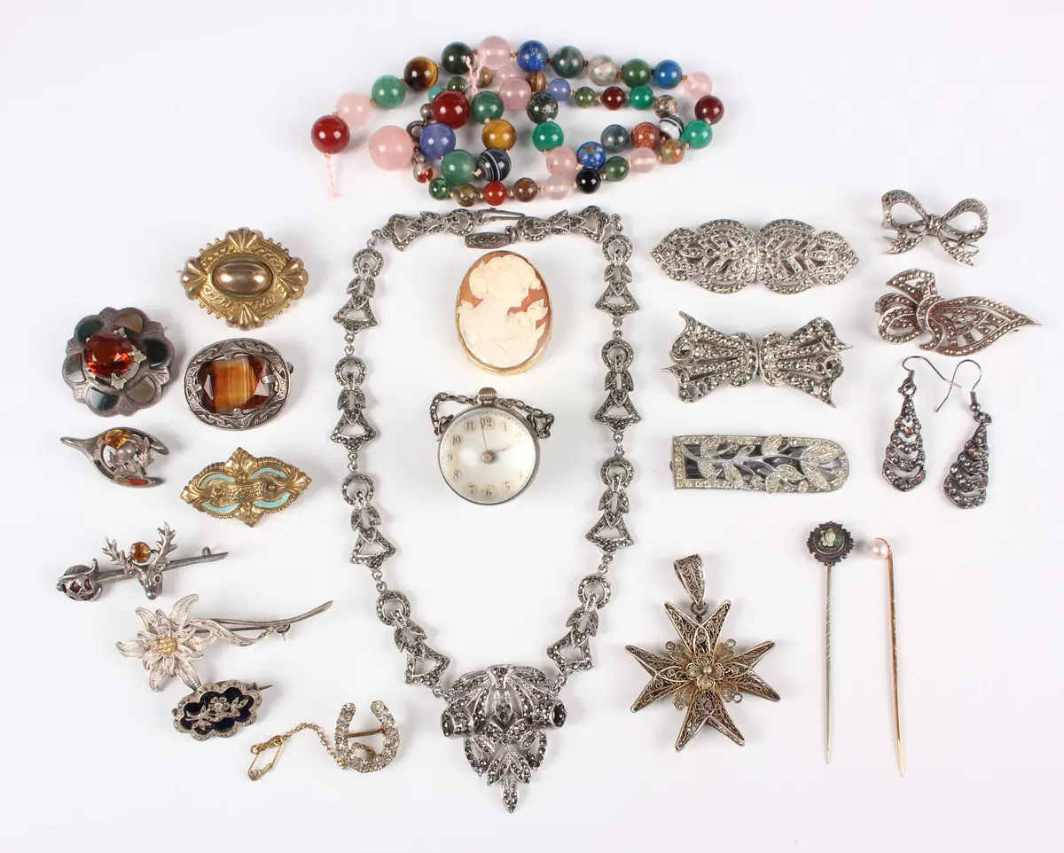A group of 19th century and later jewellery, including a glass cased