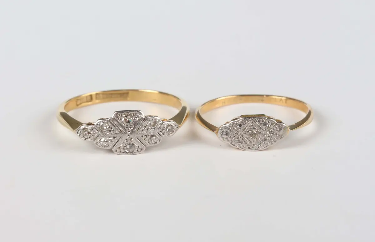 A gold, platinum and diamond eight stone ring, mounted with single