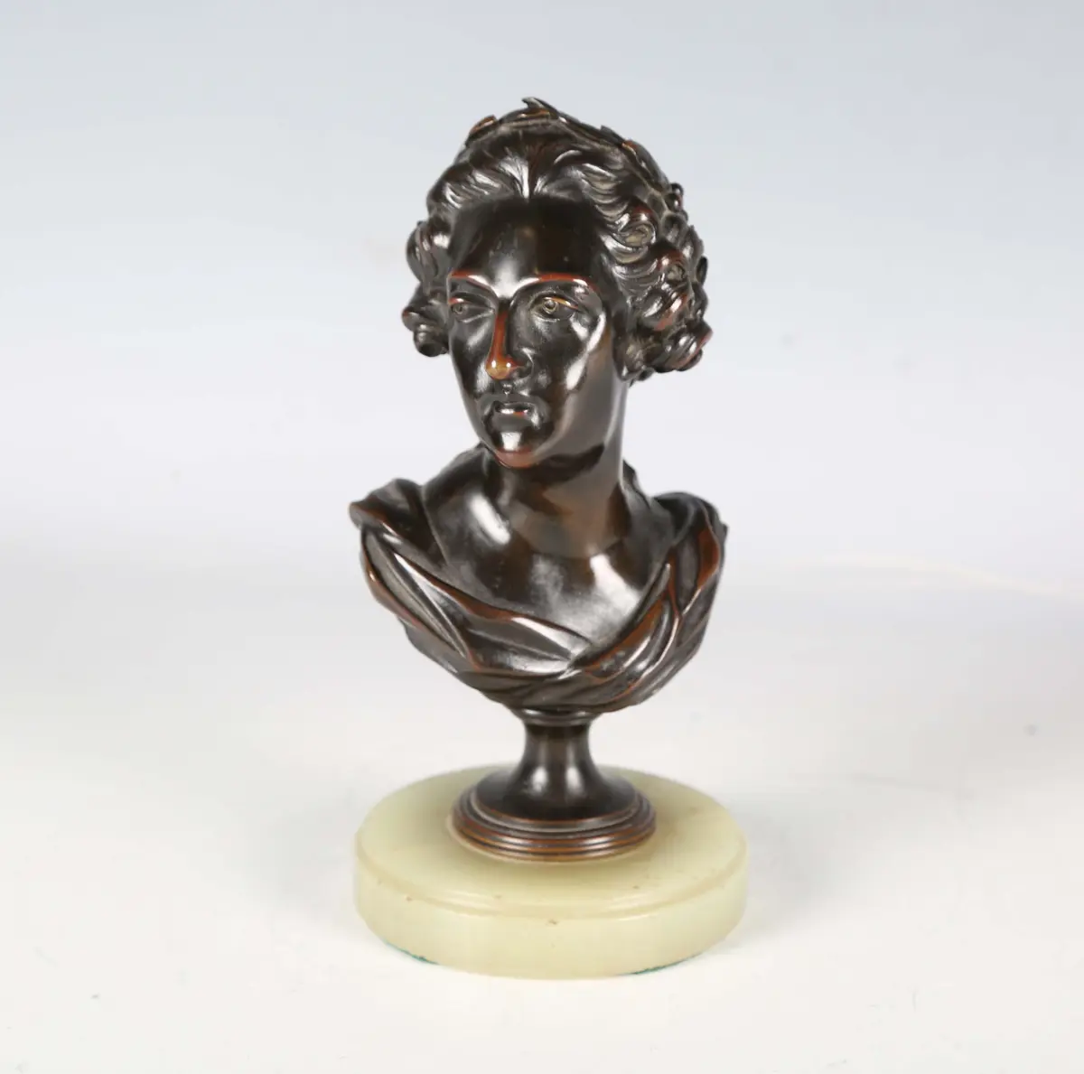 A 19th century French brown patinated cast bronze head and shoulders