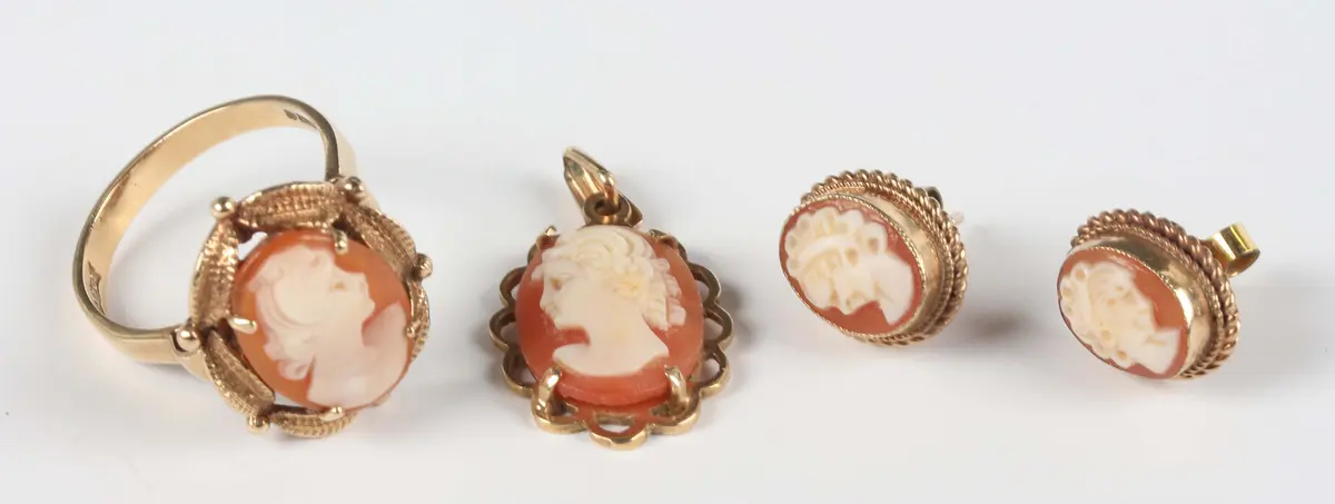 A 9ct gold and oval shell cameo ring, carved as a portrait of a lady