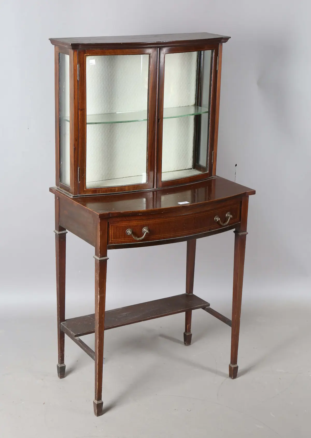 An Edwardian mahogany display cabinet-on-stand with overall boxwood