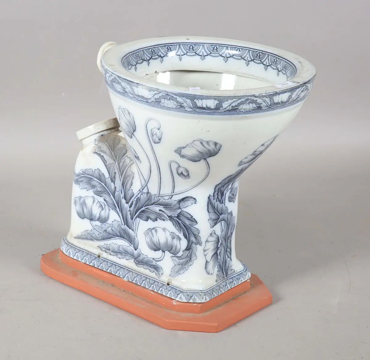 An Art Nouveau blue and white printed porcelain water closet, detailed