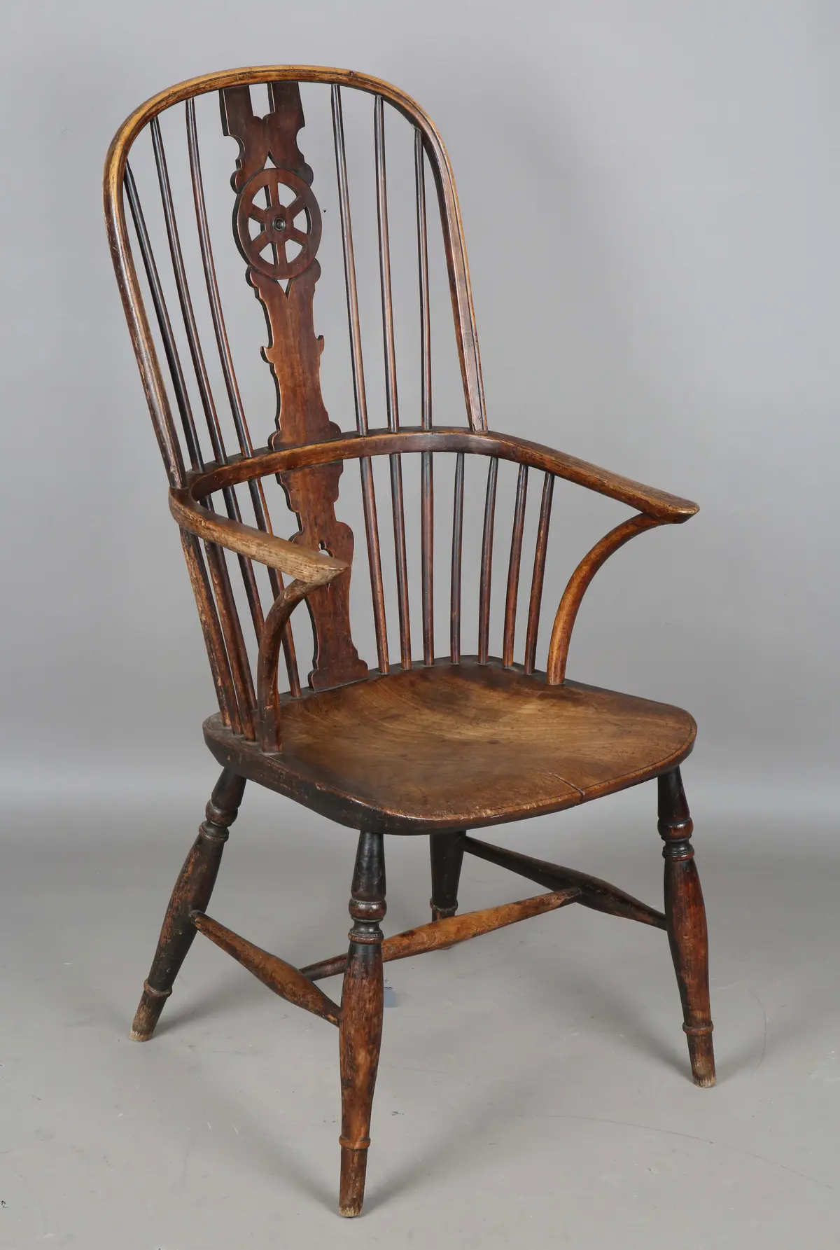 An early Victorian ash, beech and elm framed Windsor armchair with