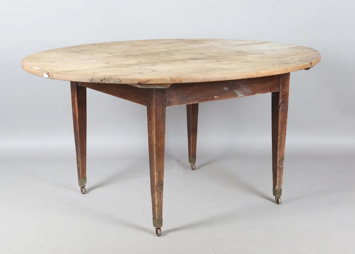 A 19th century pine oval farmhouse dining table, fitted with a single