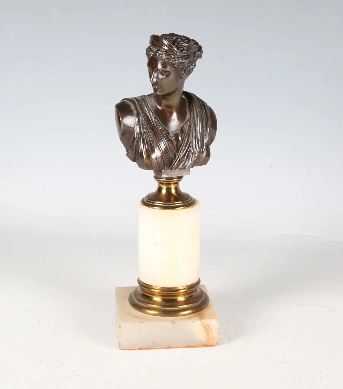 A late 19th century Continental cast bronze bust of Diana, raised