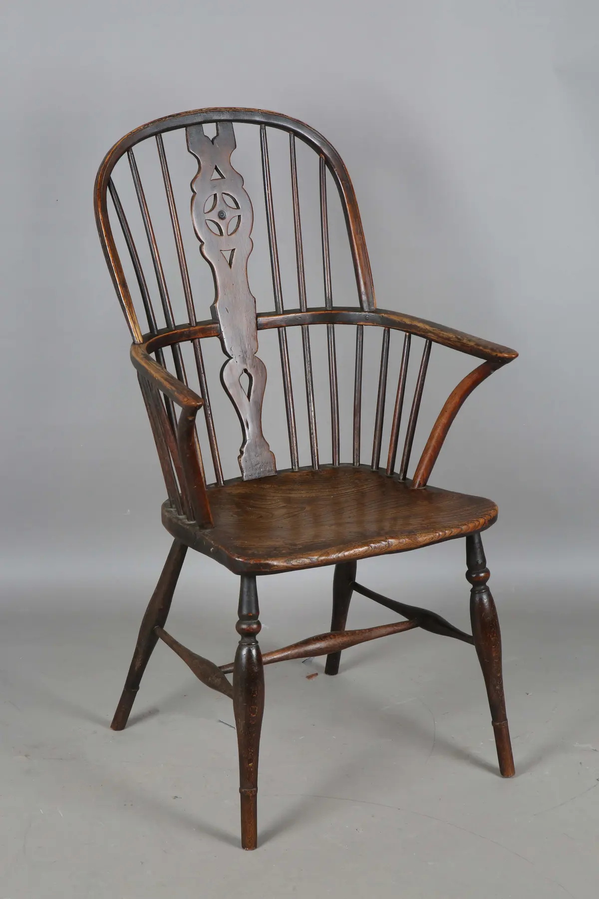 An early Victorian ash, beech and elm framed Windsor armchair with