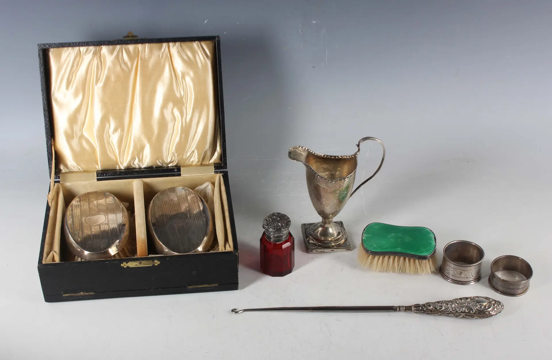 A George III silver helmet cream jug with engraved decoration, London