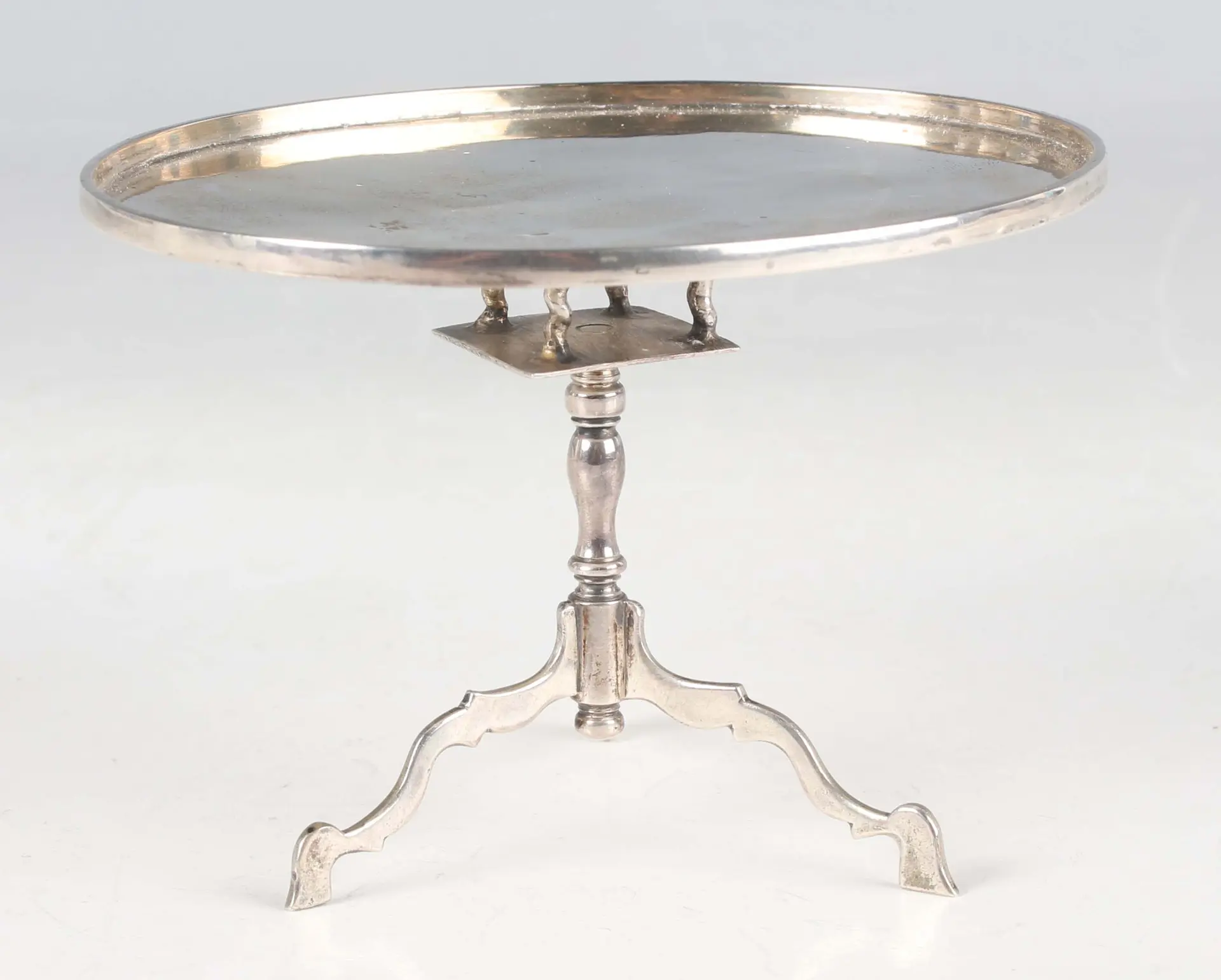An early 18th century Dutch miniature toy silver oval tilt-top table