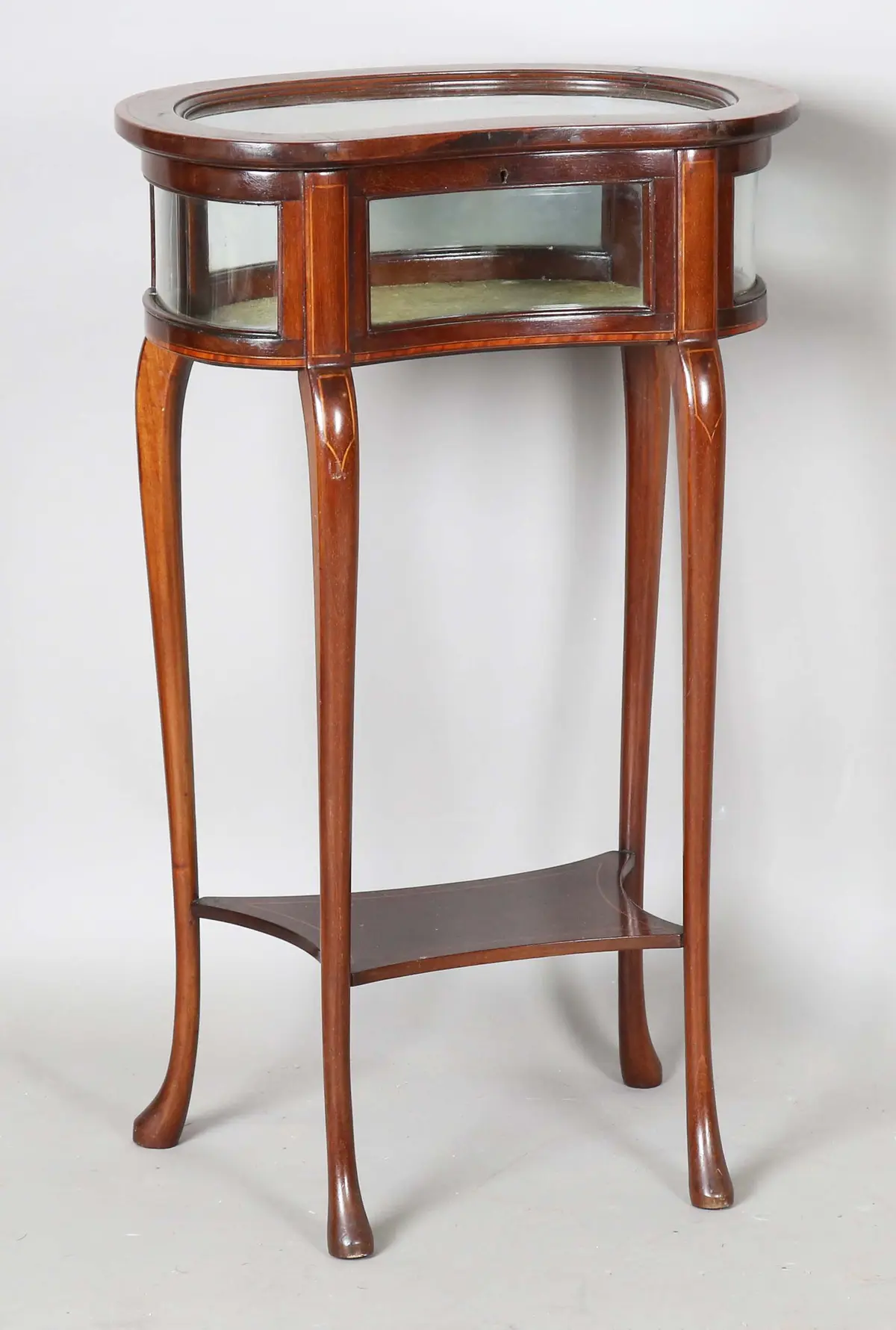 A small Edwardian mahogany kidney-shaped bijouterie table with satinwood