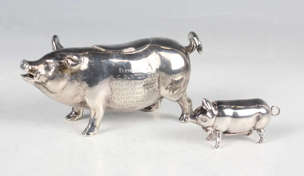 An early 20th century silver pig creamer, modelled standing with curled