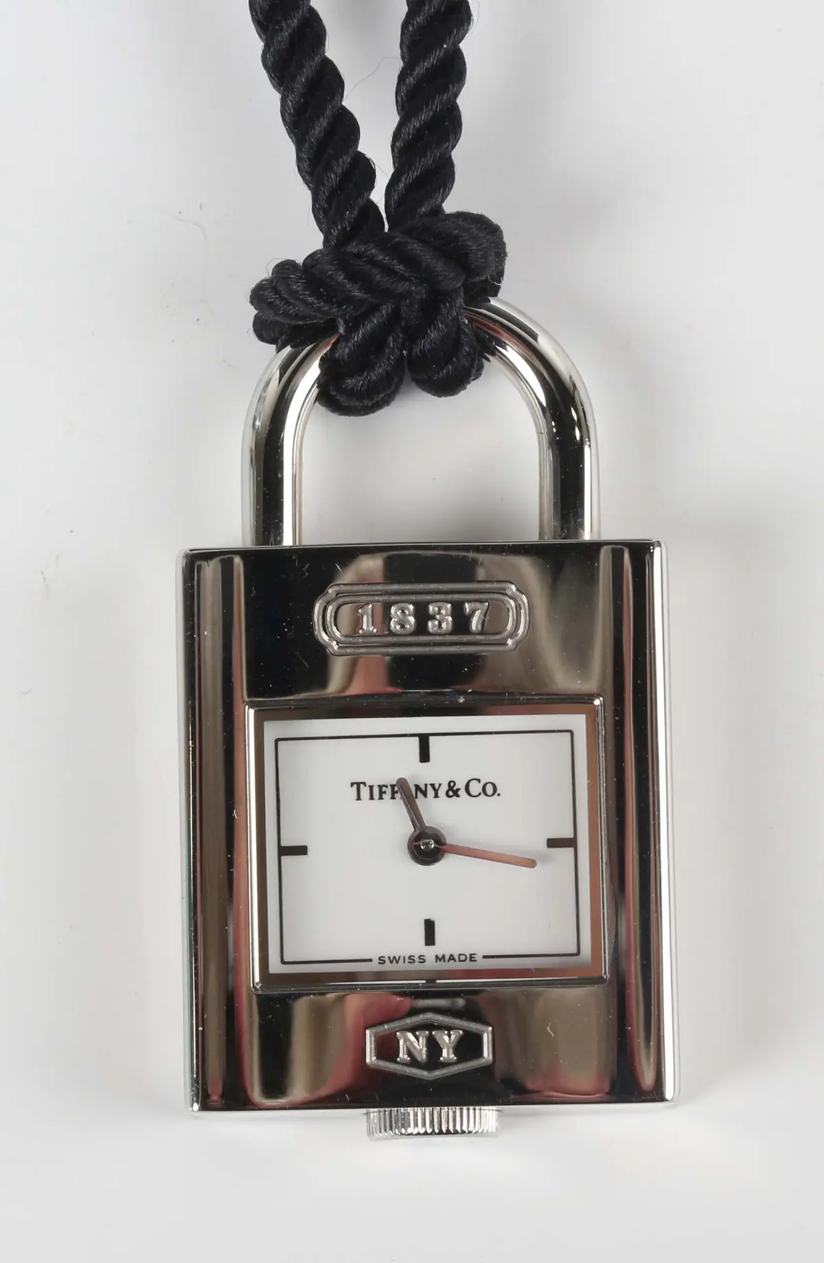 A Tiffany & Co steel cased padlock shaped pendant quartz watch, length