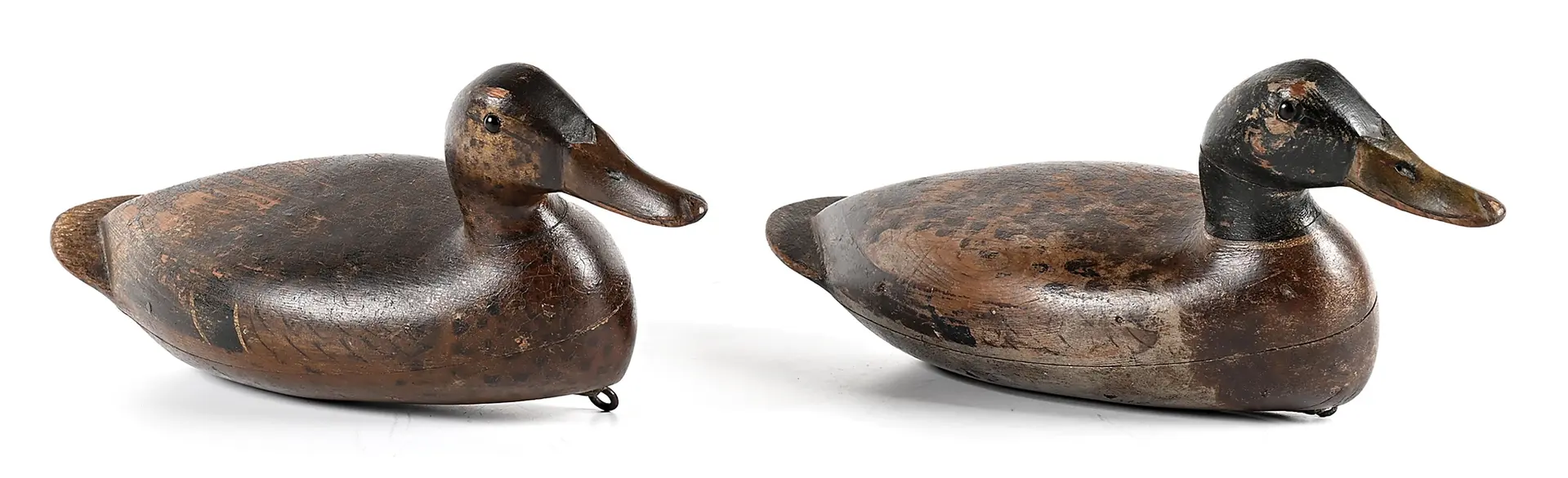 A PAIR OF VINTAGE WOODEN DUCK DECOYS