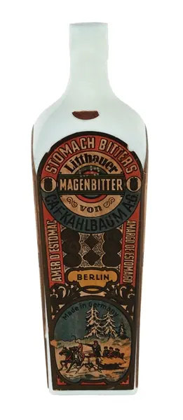 MILK GLASS LITTHAUER STOMACH BITTERS BOTTLE W/ PAPER LABEL