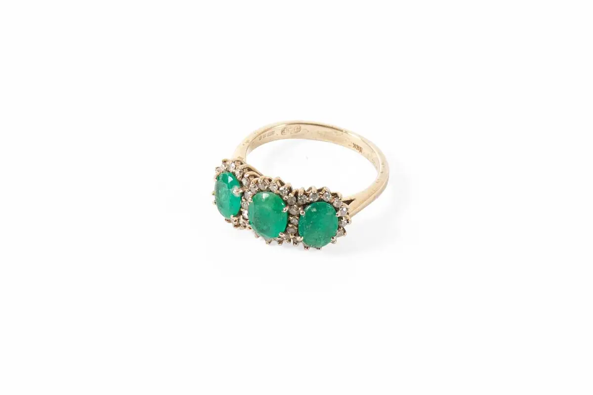 An 18 Carat White Gold Emerald and Diamond Triple Cluster Ring