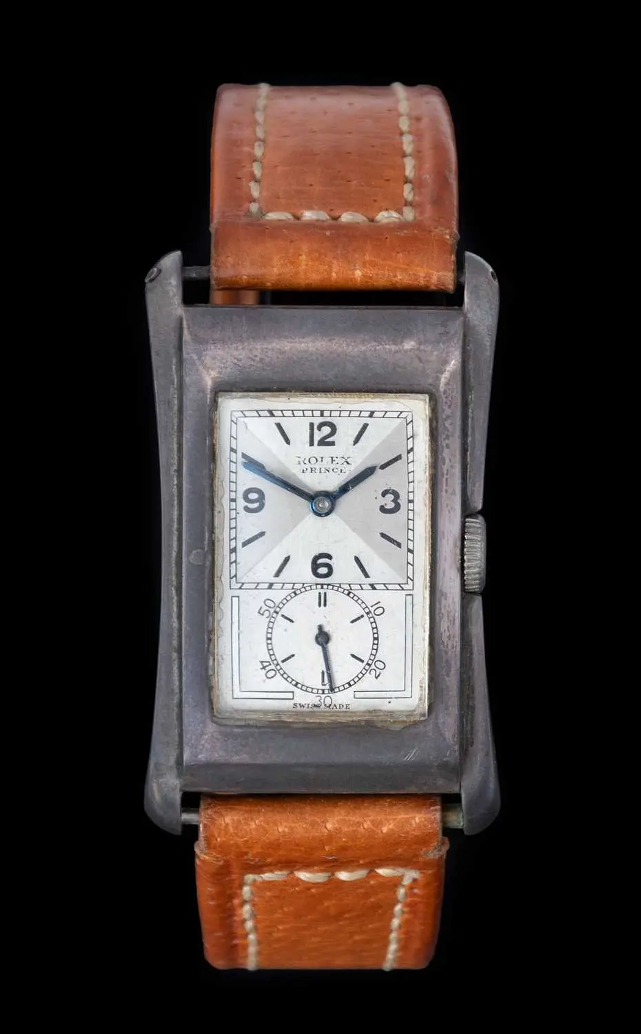 Rolex: An Art Deco Silver Flared Sided Rectangular Wristwatch, signed