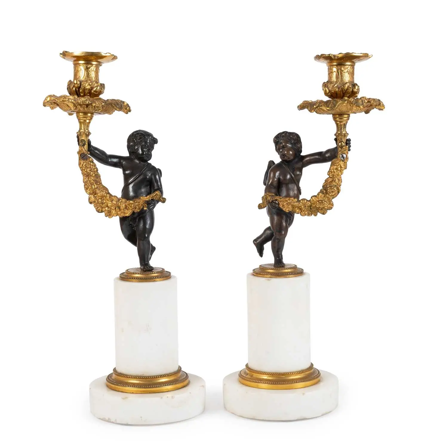 A Pair of French Gilt and Patinated Bronze Figural Candlesticks