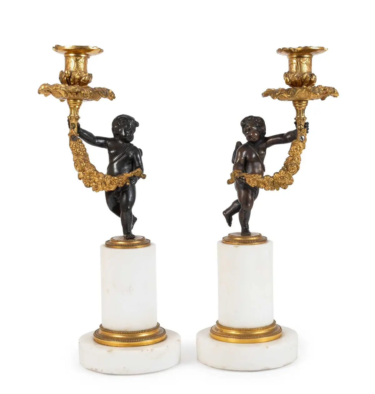 A Pair of French Gilt and Patinated Bronze Figural Candlesticks