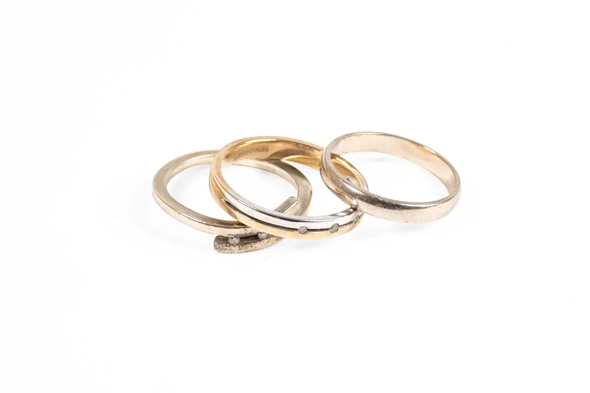 A 9 Carat White Gold Band Ring, A 9 Carat White Gold and Diamond Crossover