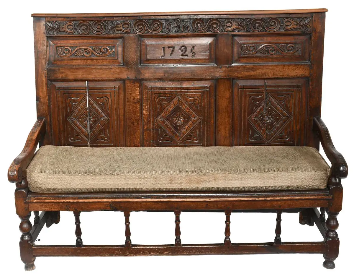 A Joined Oak and Carved High-Back Settle, initialled JGM and dated 1725
