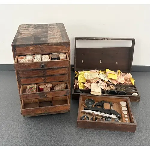 Watch crystal press with a quantity of dies, within a wooden...