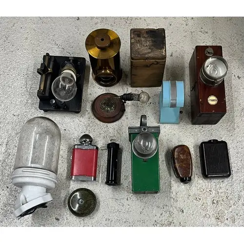 Selection of vintage battery lamps, torches and illuminating...