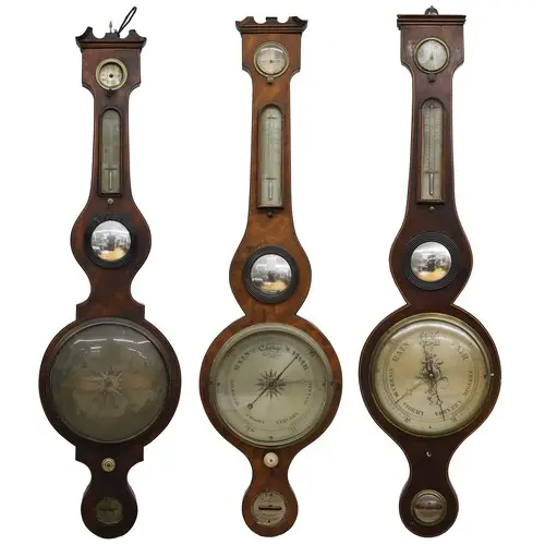 Group of three 19th century inlaid mahogany wheel barometers...